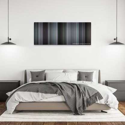 16 Blocks color palette canvas above a bed, between two black pendant lamps