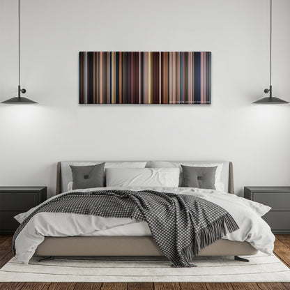 Big Fish color palette canvas above a bed, between two black pendant lamps