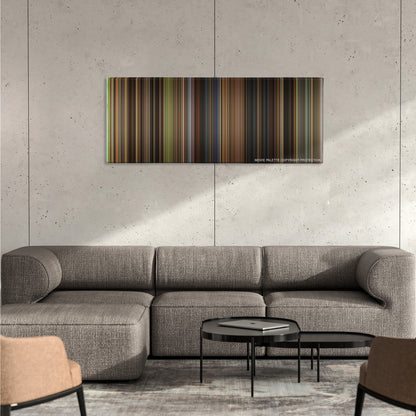 Cinderella color palette canvas on a concrete wall above a gray sectional sofa