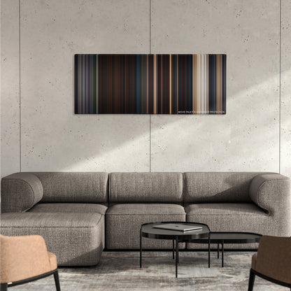Planet of the Apes color palette canvas on a concrete wall above a gray sectional sofa