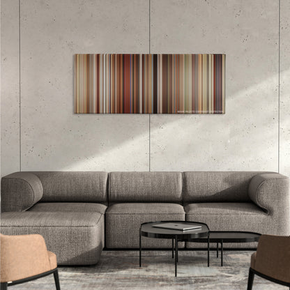 Love, Simon color palette canvas on a concrete wall above a gray sectional sofa