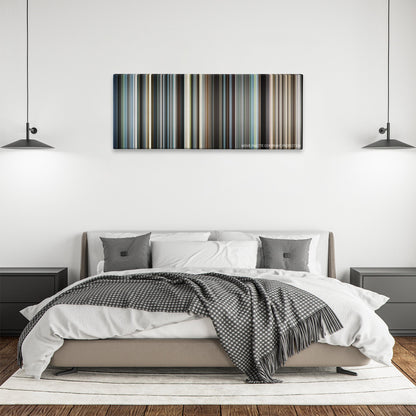 Syriana color palette canvas above a bed, between two black pendant lamps
