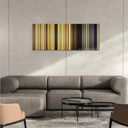 Moonrise Kingdom color palette canvas on a concrete wall above a gray sectional sofa