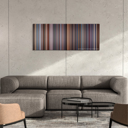 Hollow Man color palette canvas on a concrete wall above a gray sectional sofa