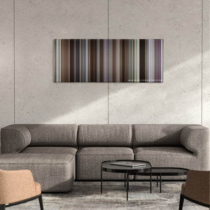 Glory color palette canvas on a concrete wall above a gray sectional sofa