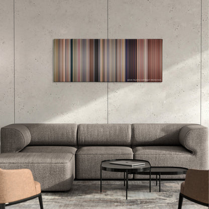 Accepted color palette canvas on a concrete wall above a gray sectional sofa