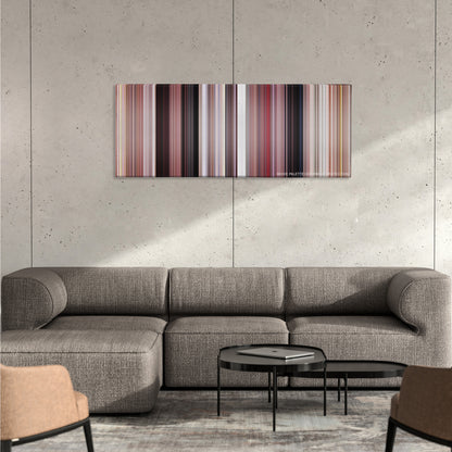 Grease color palette canvas on a concrete wall above a gray sectional sofa