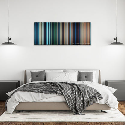 10,000 BC color palette canvas above a bed, between two black pendant lamps
