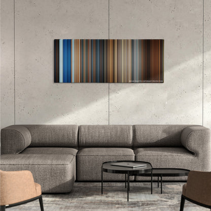 National Treasure color palette canvas on a concrete wall above a gray sectional sofa
