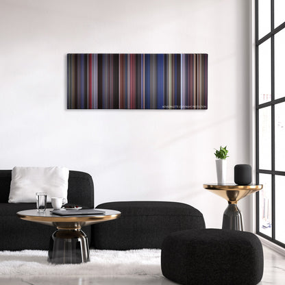 Man on the Moon color palette canvas above a black sofa with a gold-topped table