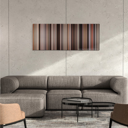 The Devil Wears Prada color palette canvas on a concrete wall above a gray sectional sofa