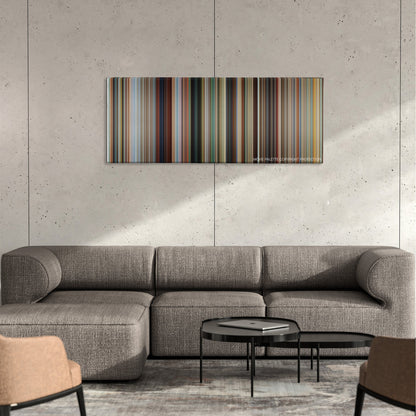 Savages color palette canvas on a concrete wall above a gray sectional sofa