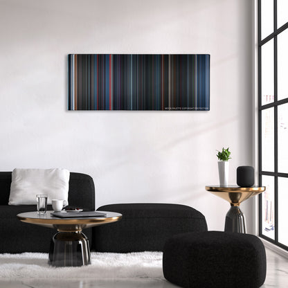 Alien vs. Predator color palette canvas above a black sofa with a gold-topped table