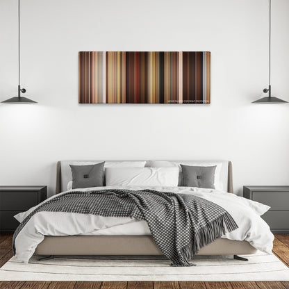 Identity Thief color palette canvas above a bed, between two black pendant lamps