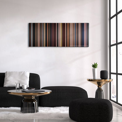 Big Fish color palette canvas above a black sofa with a gold-topped table