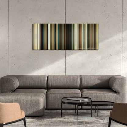 No Country for Old Men color palette canvas on a concrete wall above a gray sectional sofa