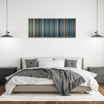 John Q color palette canvas above a bed, between two black pendant lamps