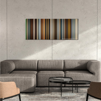 In Time color palette canvas on a concrete wall above a gray sectional sofa