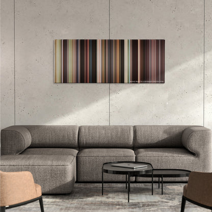 The Karate Kid color palette canvas on a concrete wall above a gray sectional sofa