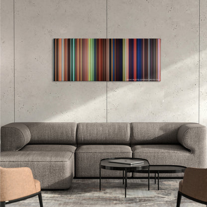 Tangled color palette canvas on a concrete wall above a gray sectional sofa