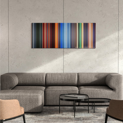 Hero color palette canvas on a concrete wall above a gray sectional sofa