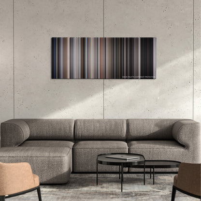 Escape from Alcatraz color palette canvas on a concrete wall above a gray sectional sofa
