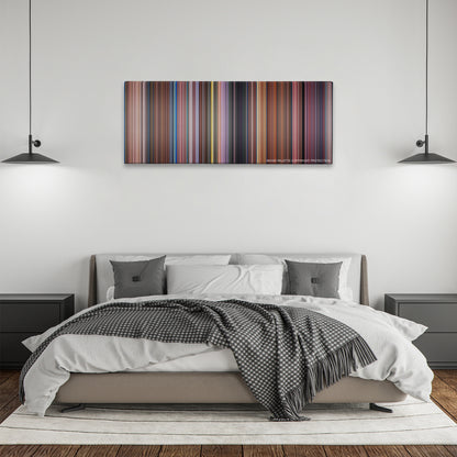 Peter Pan color palette canvas above a bed, between two black pendant lamps