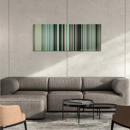 Dunkirk color palette canvas on a concrete wall above a gray sectional sofa