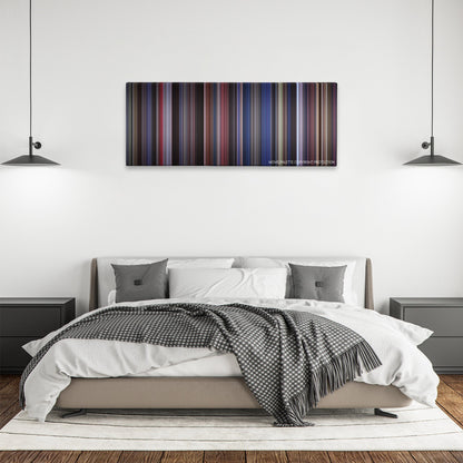 Man on the Moon color palette canvas above a bed, between two black pendant lamps