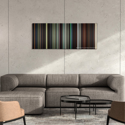Eragon color palette canvas on a concrete wall above a gray sectional sofa