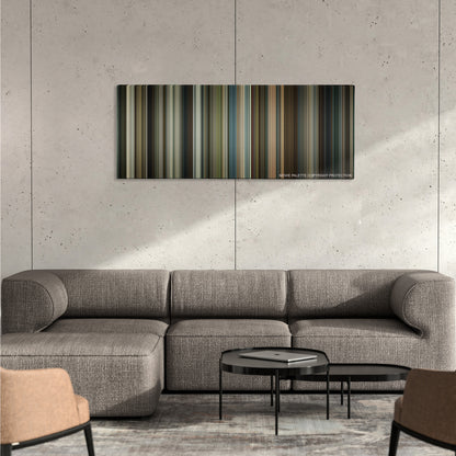Black Mass color palette canvas on a concrete wall above a gray sectional sofa