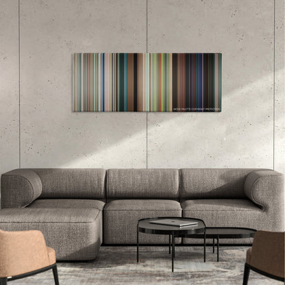 The Bounty Hunter color palette canvas on a concrete wall above a gray sectional sofa