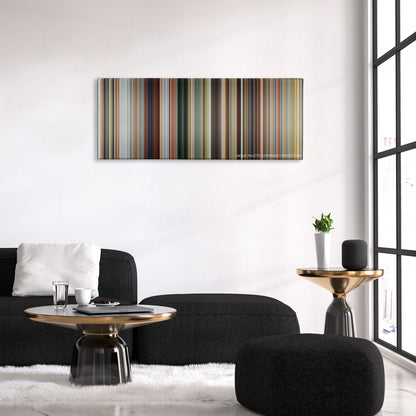 Savages color palette canvas above a black sofa with a gold-topped table