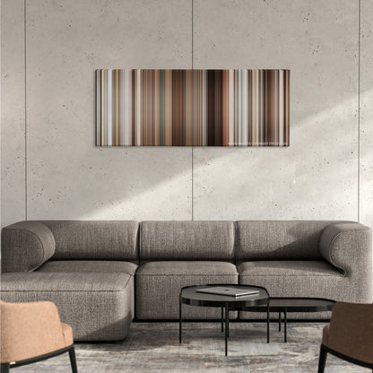 Stranger Than Fiction color palette canvas on a concrete wall above a gray sectional sofa