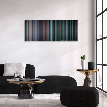 The Hunger Games color palette canvas above a black sofa with a gold-topped table