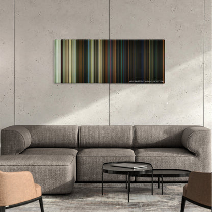 Halloween color palette canvas on a concrete wall above a gray sectional sofa