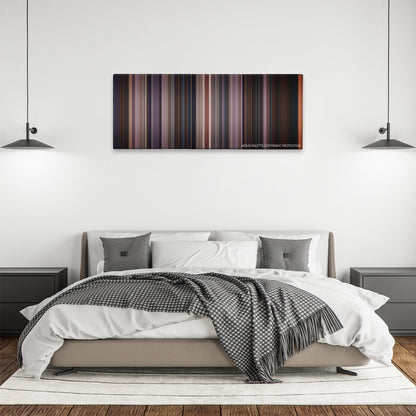 Scream 3 color palette canvas above a bed, between two black pendant lamps