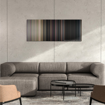 Dazed and Confused color palette canvas on a concrete wall above a gray sectional sofa