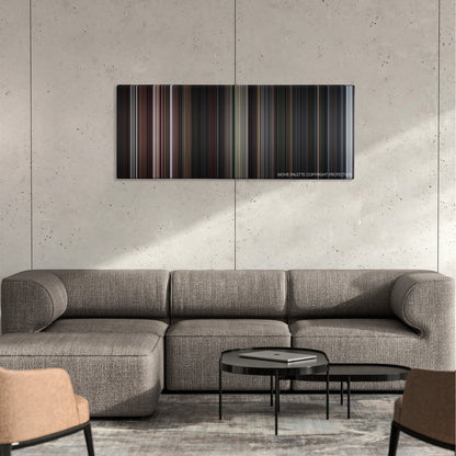 The Score color palette canvas on a concrete wall above a gray sectional sofa