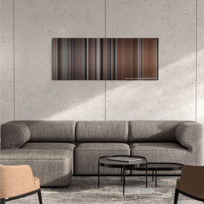 My Cousin Vinny color palette canvas on a concrete wall above a gray sectional sofa