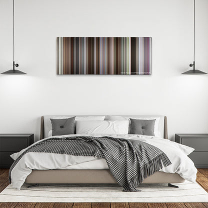 Glory color palette canvas above a bed, between two black pendant lamps