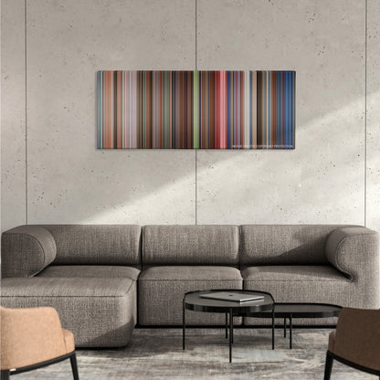 The Shining color palette canvas on a concrete wall above a gray sectional sofa