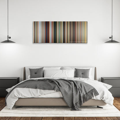Savages color palette canvas above a bed, between two black pendant lamps