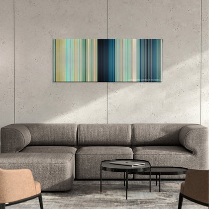 The Shallows color palette canvas on a concrete wall above a gray sectional sofa