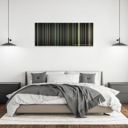 J. Edgar color palette canvas above a bed, between two black pendant lamps