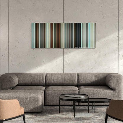 Hot Fuzz color palette canvas on a concrete wall above a gray sectional sofa