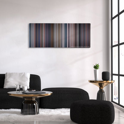 Tomorrow Never Dies color palette canvas above a black sofa with a gold-topped table