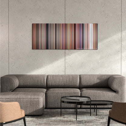 Willy Wonka & the Chocolate Factory color palette canvas on a concrete wall above a gray sectional sofa