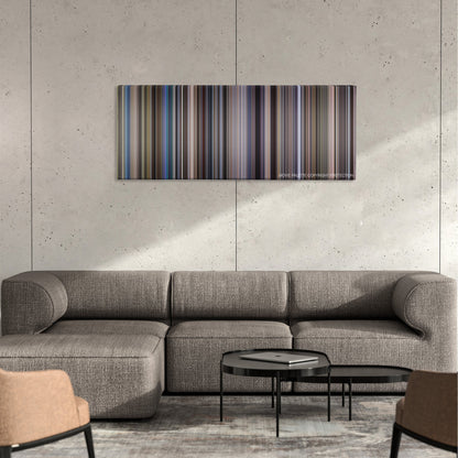 Outbreak color palette canvas on a concrete wall above a gray sectional sofa