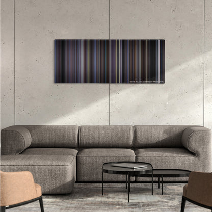 Donnie Darko color palette canvas on a concrete wall above a gray sectional sofa